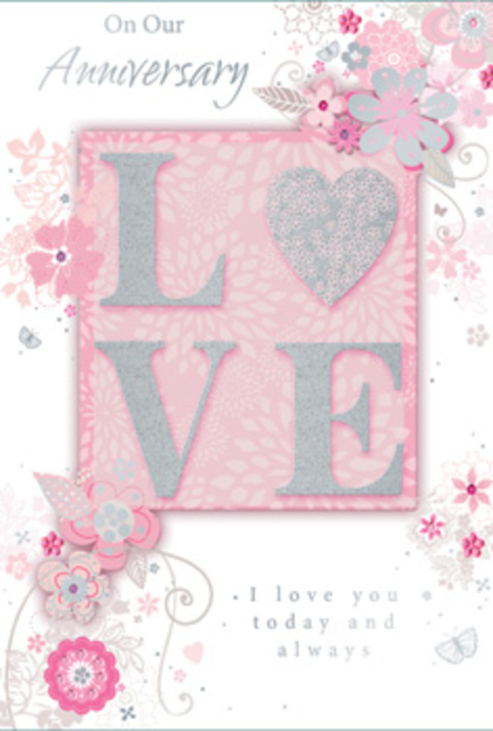 The anniversary card in this image has the gentle grace of a hand-tied bouquet translated into paper, evoking the quiet, everyday love shared in homes across Southgate. Dominating the front panel, the word LOVE appears in raised, glittering letters that blend frosted blush pink with shimmering pearlescent white. The texture is subtly grainy and tactile, catching and scattering the light like tiny crystals, similar to how morning sun glints off dew-covered petals in Grovelands Park. The background is a soft, velvety pink, calm and reassuring, providing a warm backdrop for the intricate floral artwork that curls around the central word. Wispy, stylised flowers and fine leafy tendrils trace delicate arcs along the card, their lines so slender they resemble ink sketches in a florist's notebook. Each bloom is shaded with gentle gradients of blush, ivory, and soft grey, giving a sense of depth without overwhelming the composition. Hints of silver foil accent some petals and leaves, adding a refined sparkle that suggests quiet celebration rather than bold glamour. Tucked among the florals, elegant script lettering carries an anniversary sentiment, the curves of the typography echoing the swirling vines. The overall impression is one of tenderness and meaningful continuity, like the steady rhythm of anniversaries shared over years of walks along Southgate High Street. This card feels as though it could sit beside a vase of pale roses and lisianthus, perfectly complementing a romantic anniversary bouquet delivered locally.